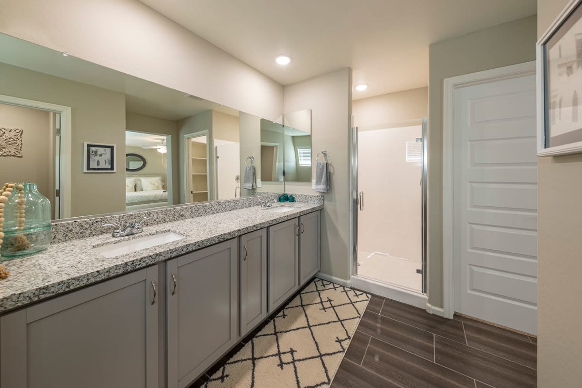 Bathroom with dual sinks at The Reserve at Eastmark in Mesa, Arizona