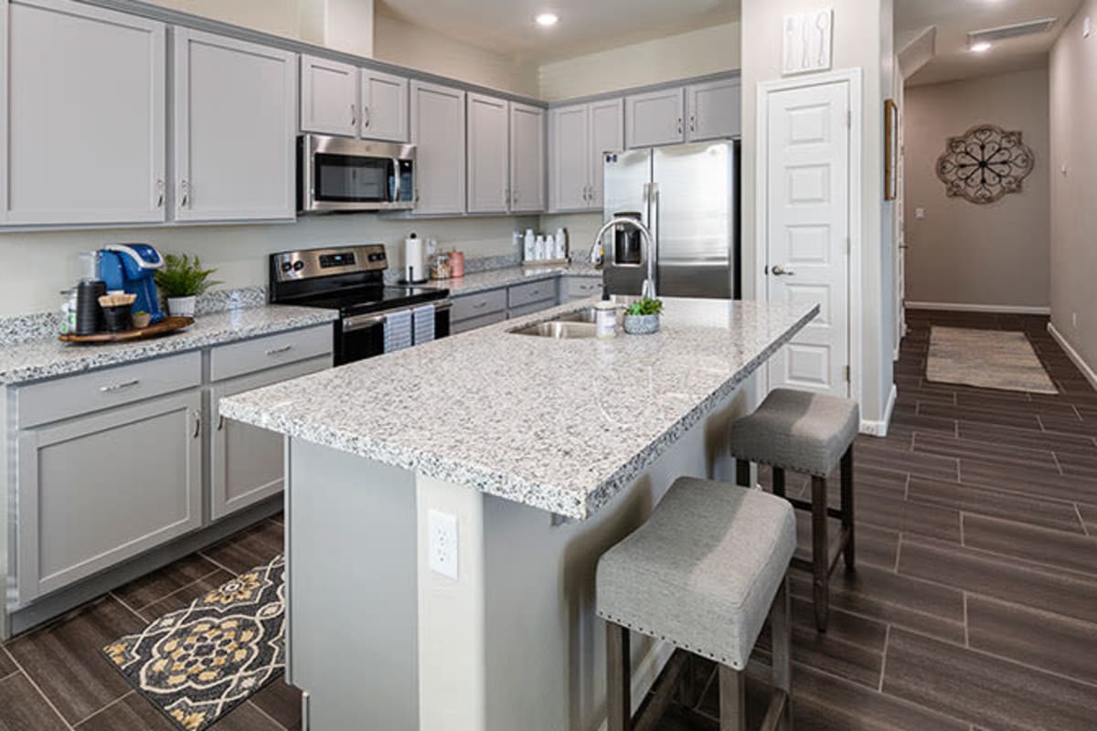 Kitchen island with granite countertops at The Reserve at Eastmark in Mesa, Arizona
