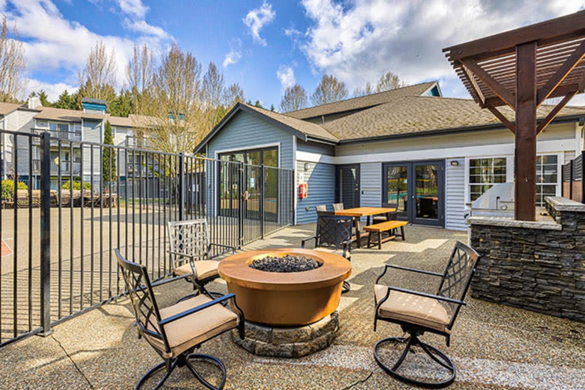Outdoor fire pit with comfy chairs at The Retreat at Bothell in Bothell, Washington