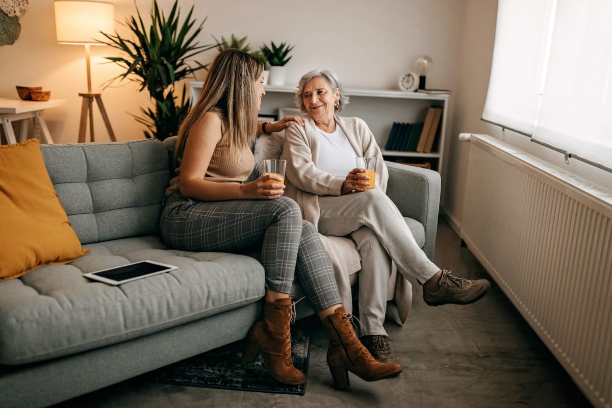 Family visiting resident in their living room at Trustwell Living at Westwood Place in Woodsfield, Ohio