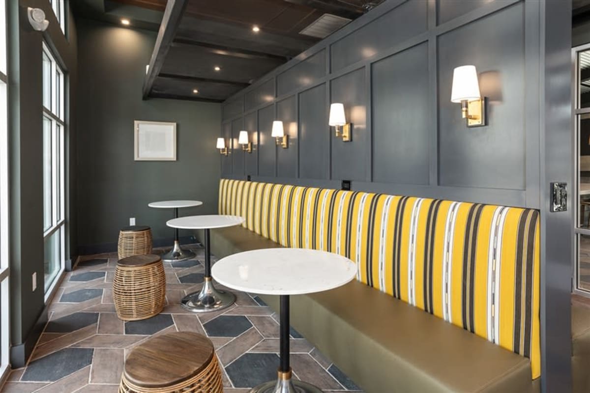 Clubroom with tall circle tables at The Retreat at Rio Salado, Tempe, Arizona