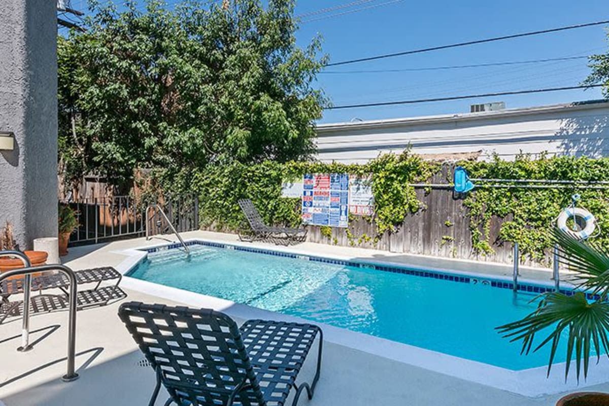Pool with lounge chairs at Villa Bianca, West Hollywood, California