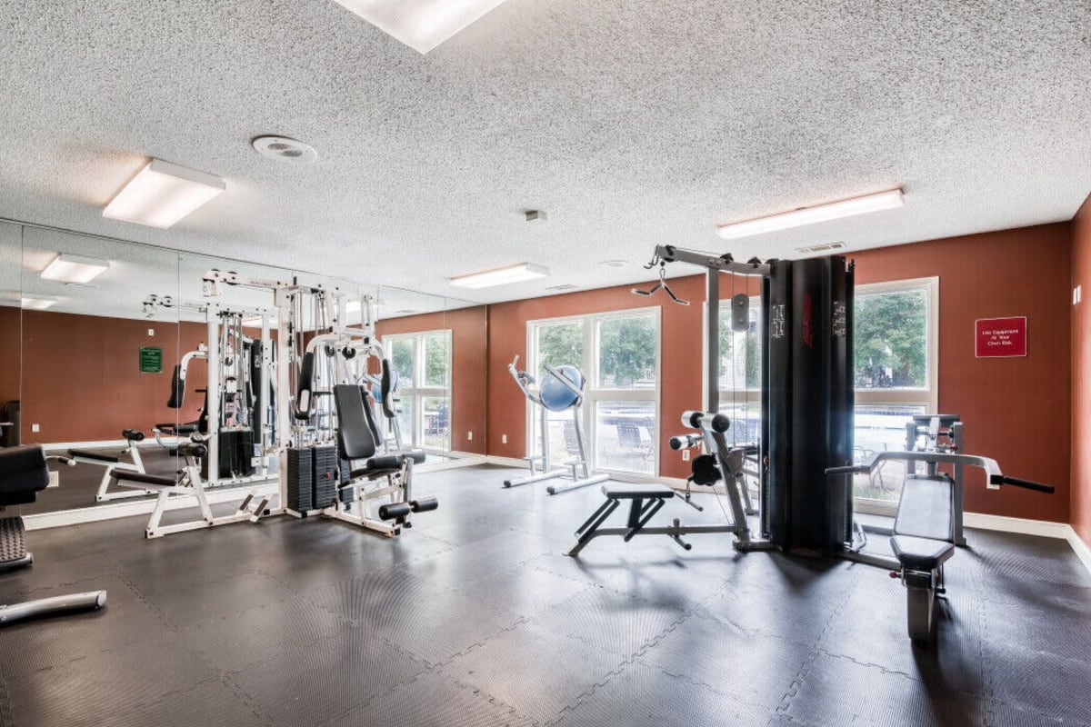 Fitness center with a lot of natural light at Trinity Lakes in Cordova, Tennessee
