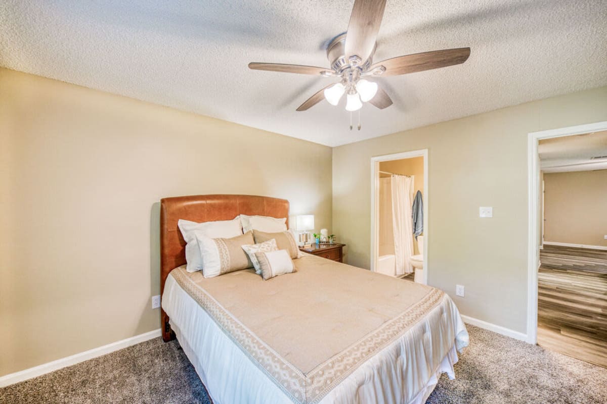 Model bedroom with ceiling fan at The Willows at Shelby Farms in Cordova, Tennessee