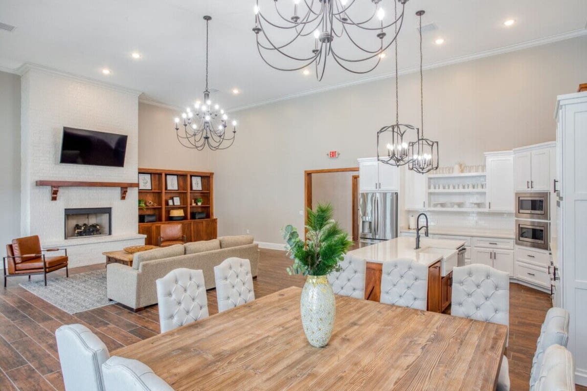 Model dining area with light accents at The Landing at Greensborough Village in Jonesboro, Arkansas