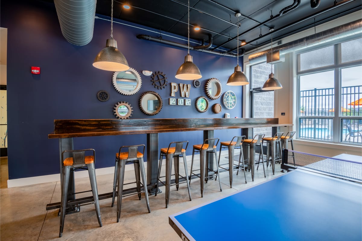 Clubhouse with bar and ping pong table at Park West 205 Apartment Homes in Pittsburgh, Pennsylvania