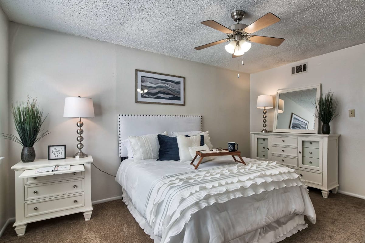 Resident bedroom with ceiling fan at Cobblestone at Essen in Baton Rouge, Louisiana
