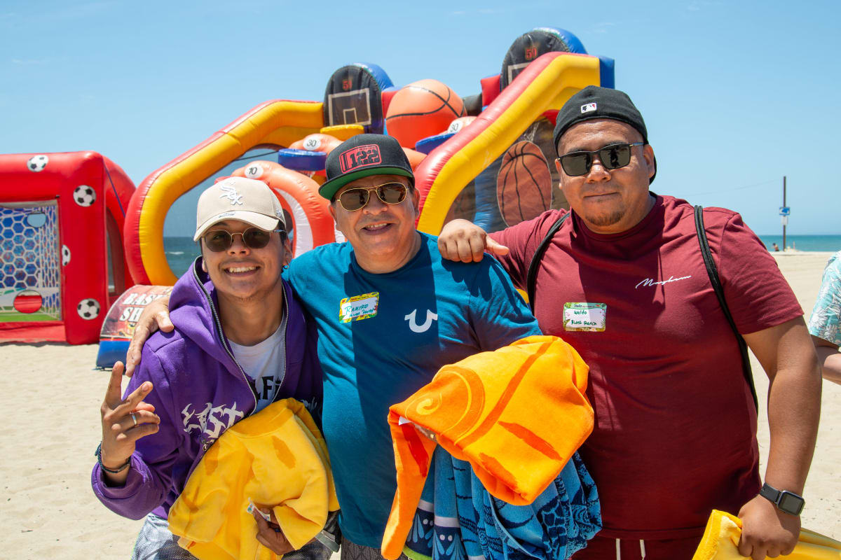 Team mates volunteer at the beach Decron Properties, Los Angeles, California