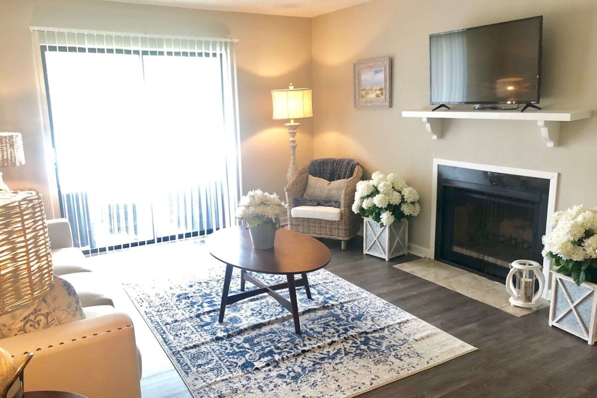 Living space with fireplace at Oakleigh Apartments in Baton Rouge, Louisiana
