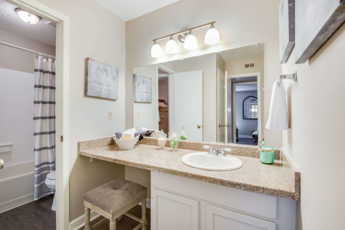 Resident bathroom with great lighting at Oakleigh Apartments in Baton Rouge, Louisiana