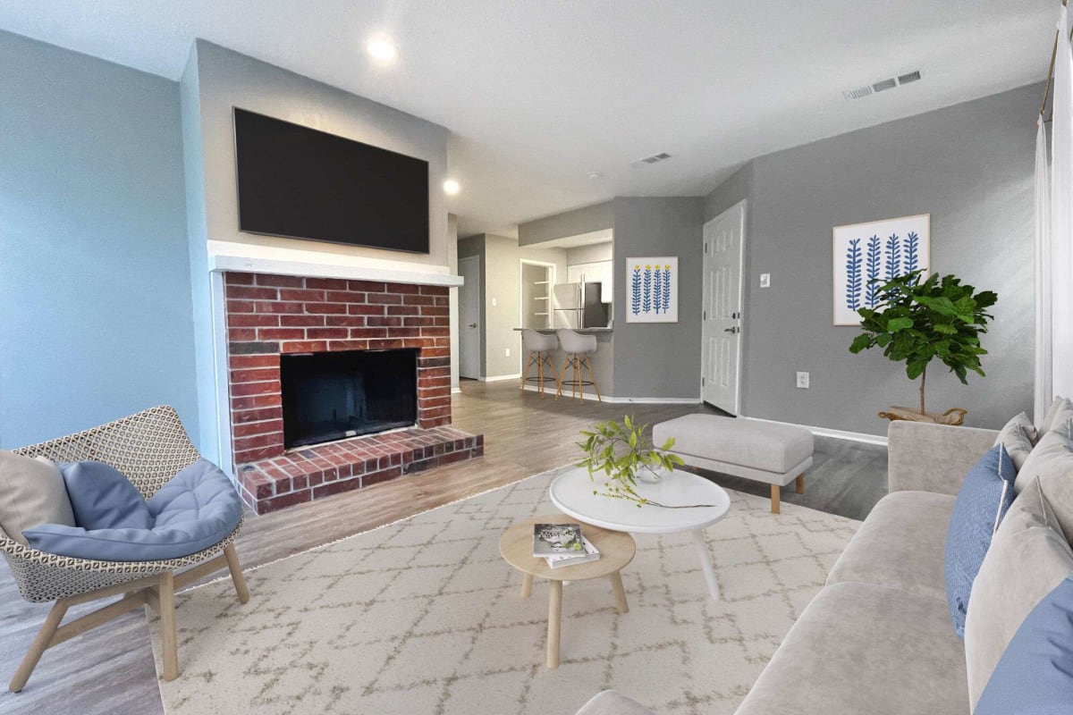 Living room with a fireplace at Atlas at Lakeview in Baton Rouge, Louisiana