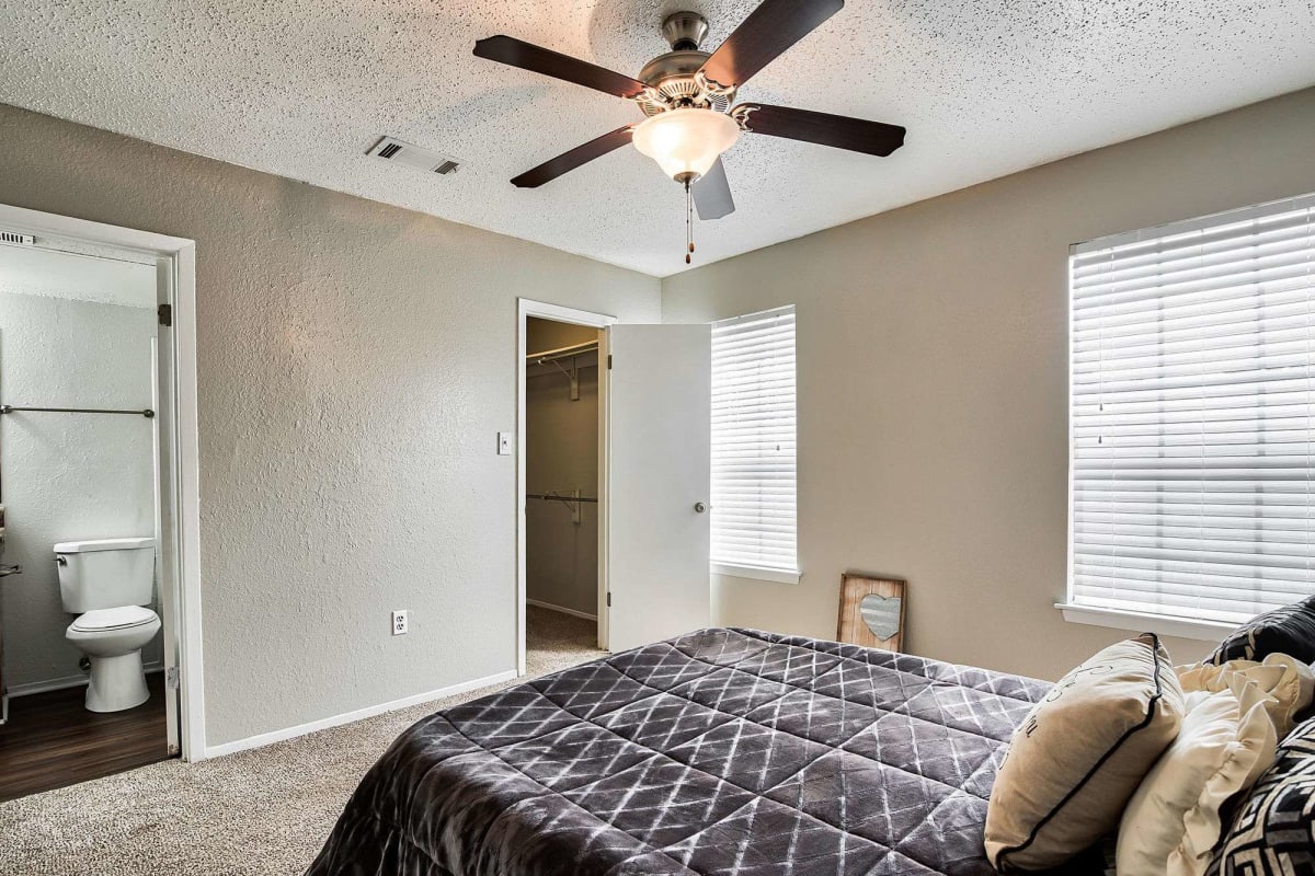 Bedroom with ceiling fan at Atlas at Lakeview in Baton Rouge, Louisiana