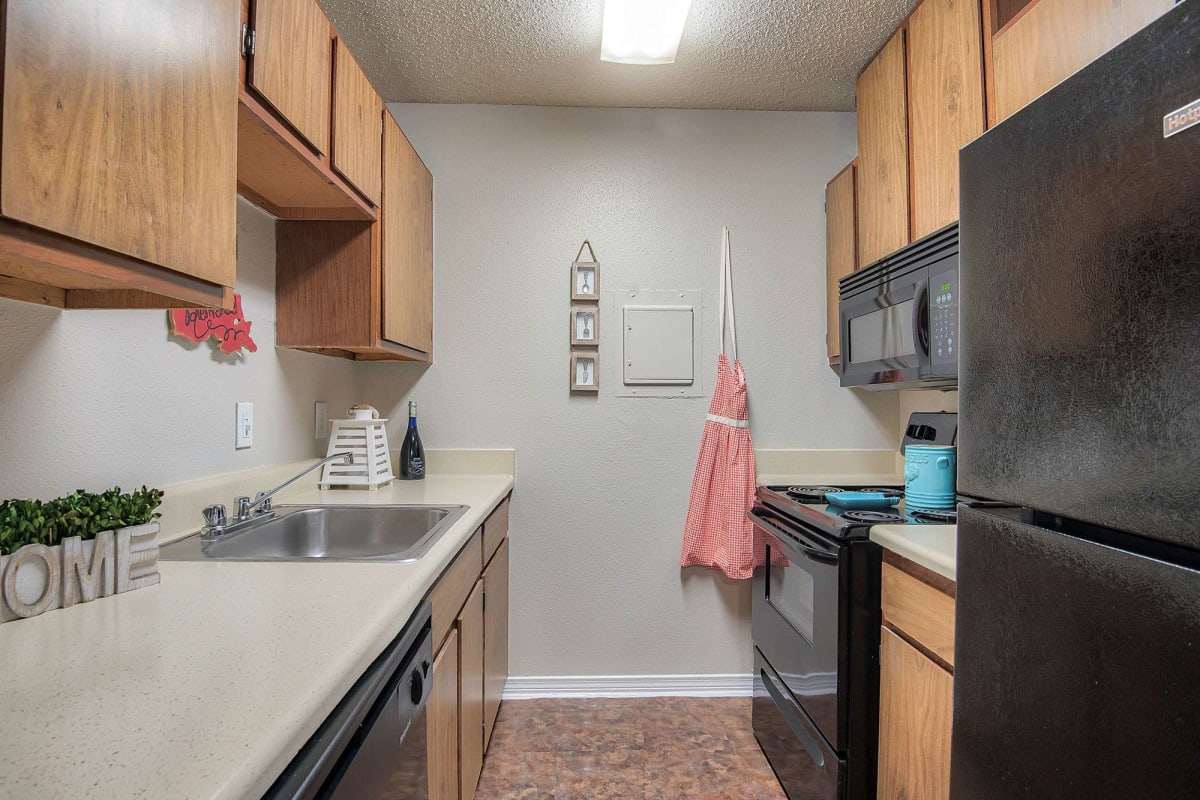Resident kitchen with modern appliances at St. Germaine in Harvey, Louisiana