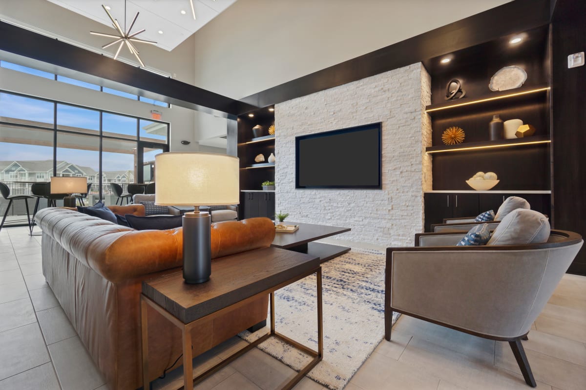 Community clubhouse with lots of seating and a tv at Seasons at North Aurora in North Aurora, Illinois