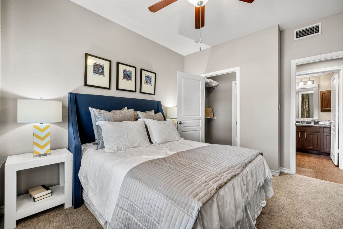 Bedroom with a ceiling fan at Marquis at Deerfield in San Antonio, Texas 