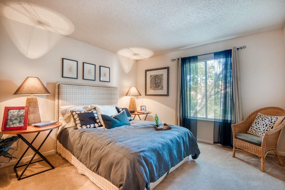 Resident bedroom with ample natural light at Casa De Fuentes in Overland Park, Kansas