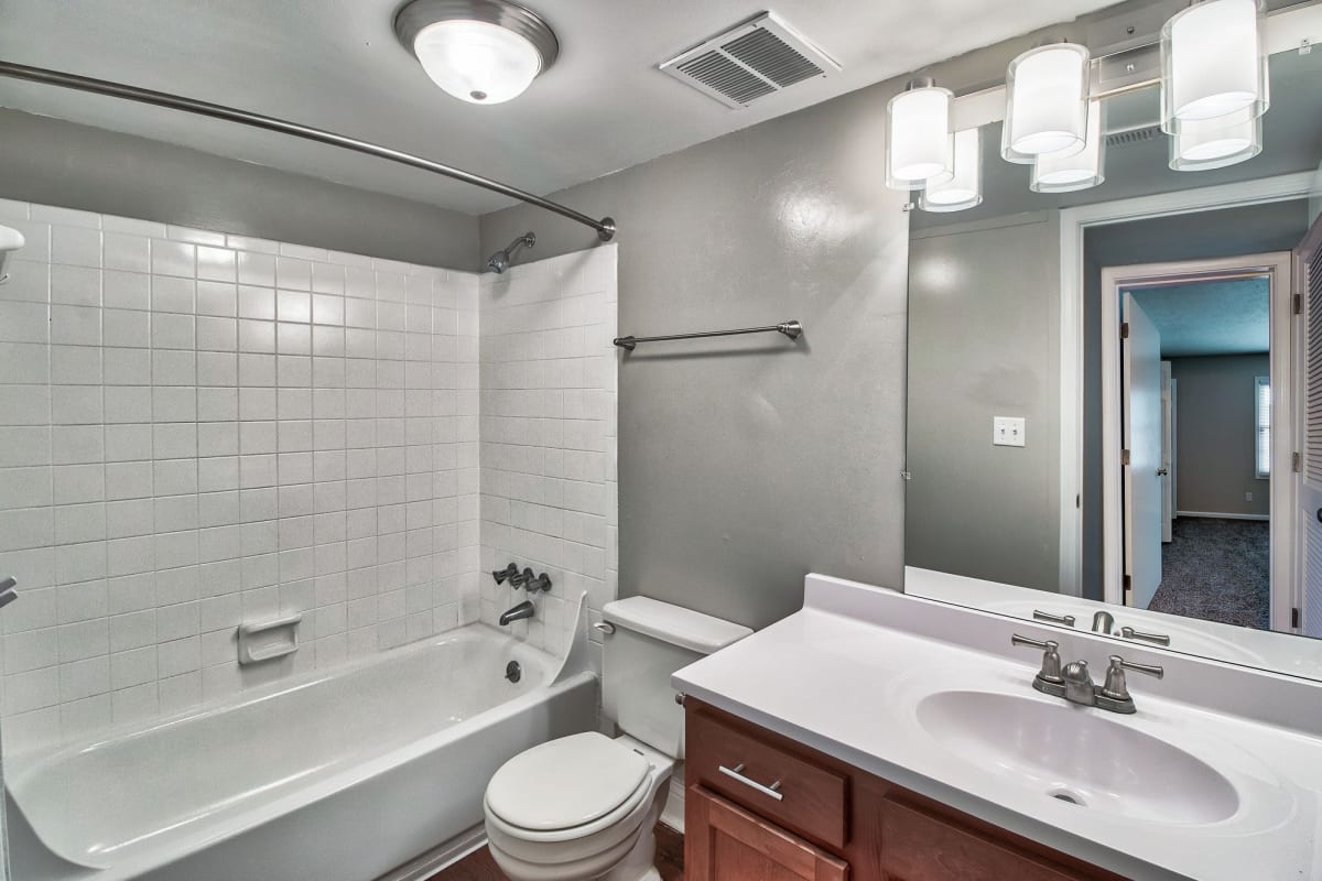 Bathroom with ample lighting at Charlestown of Douglass Hills in Louisville, Kentucky