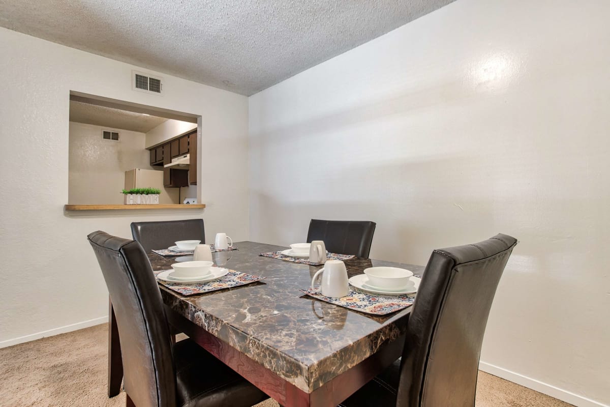 Resident dining room with table and chairs at Creekside in San Angelo, Texas