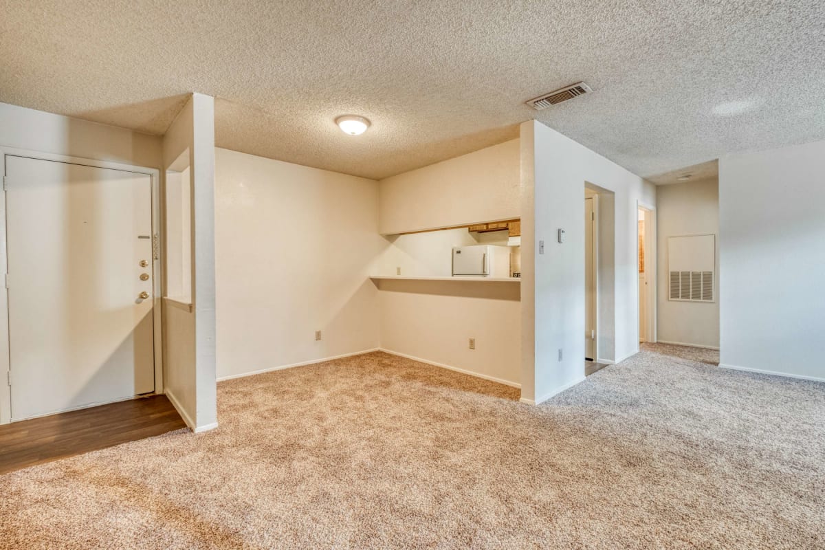 Resident living space with plush carpeting at Hunters Glen in Killeen, Texas
