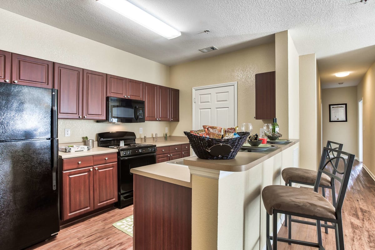 Resident kitchen with a breakfast bar at Independence Place in Clarksville, Tennessee