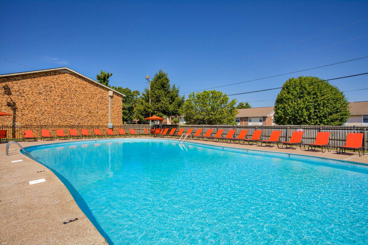 Refreshing swimming pool with lots of seating at Paddock Place and The Oaks in Clarksville, Tennessee