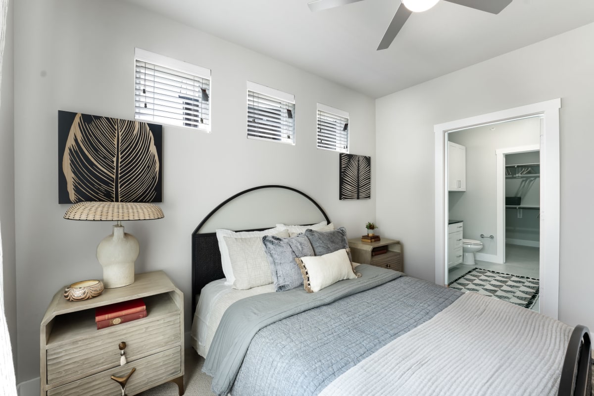 Model luxury one bedroom with natural lighting and queen size bedroom at The Bennett in Austin, Texas