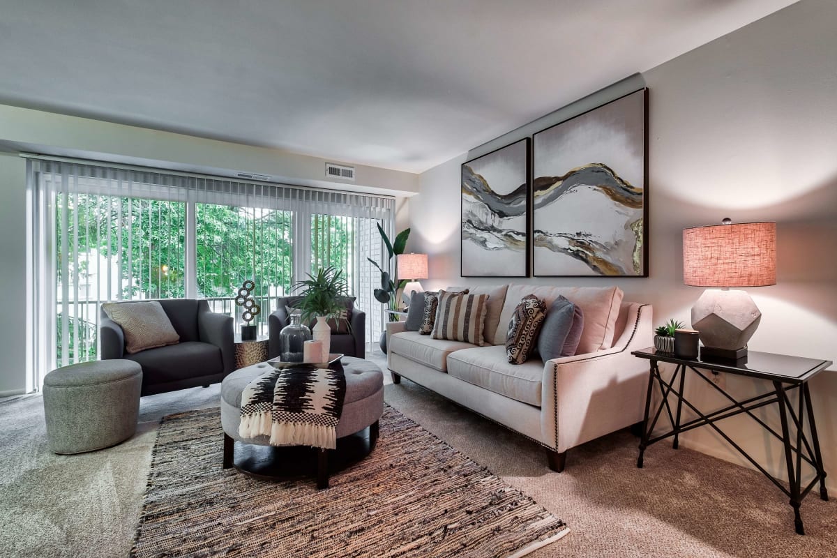 Resident modern living space with plush carpeting at Suburban Park in York, Pennsylvania