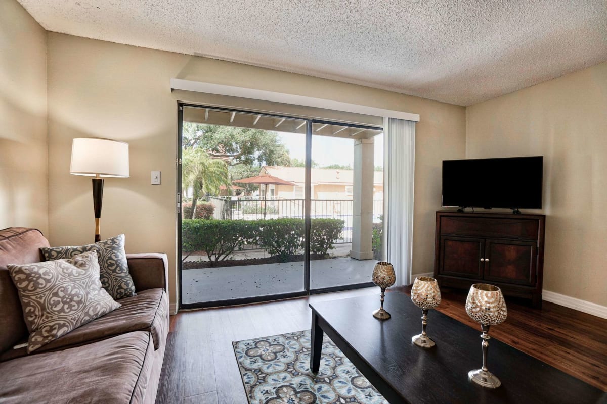 Resident living space with access to the patio at Royal Palms in Orlando, Florida
