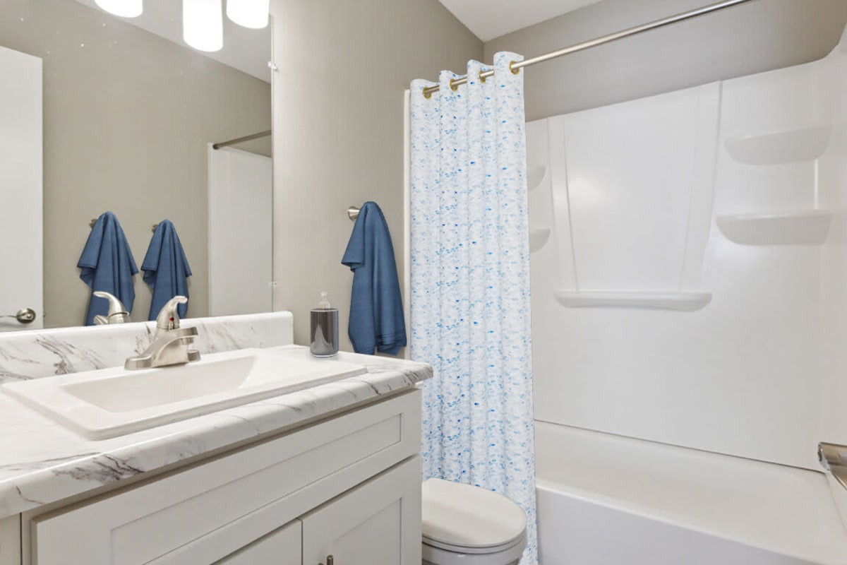 Resident bathroom with great lighting at The Park Apartments in Mobile, Alabama