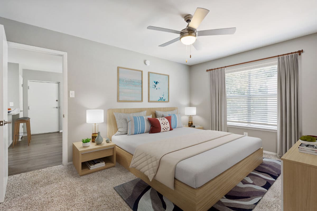 Master bedroom with ceiling fan at The Park Apartments in Mobile, Alabama