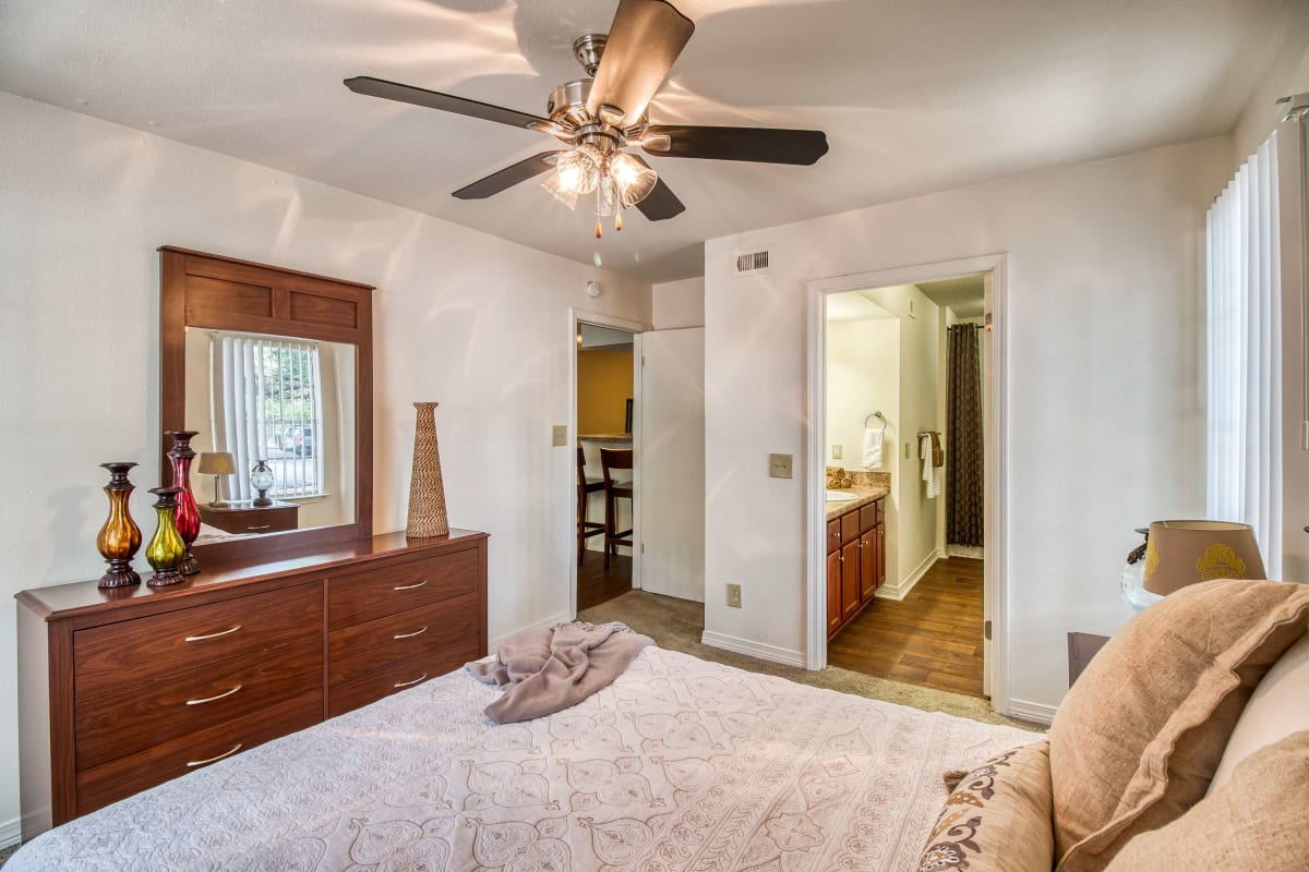 Master bedroom with a ceiling fan at Arbor Club in Pensacola, Florida