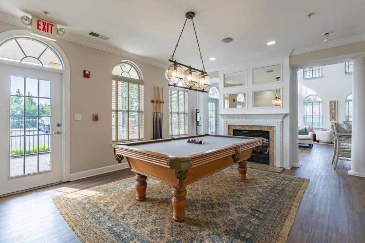 Billiards room with pool table at Atkins Circle Apartments and Townhomes