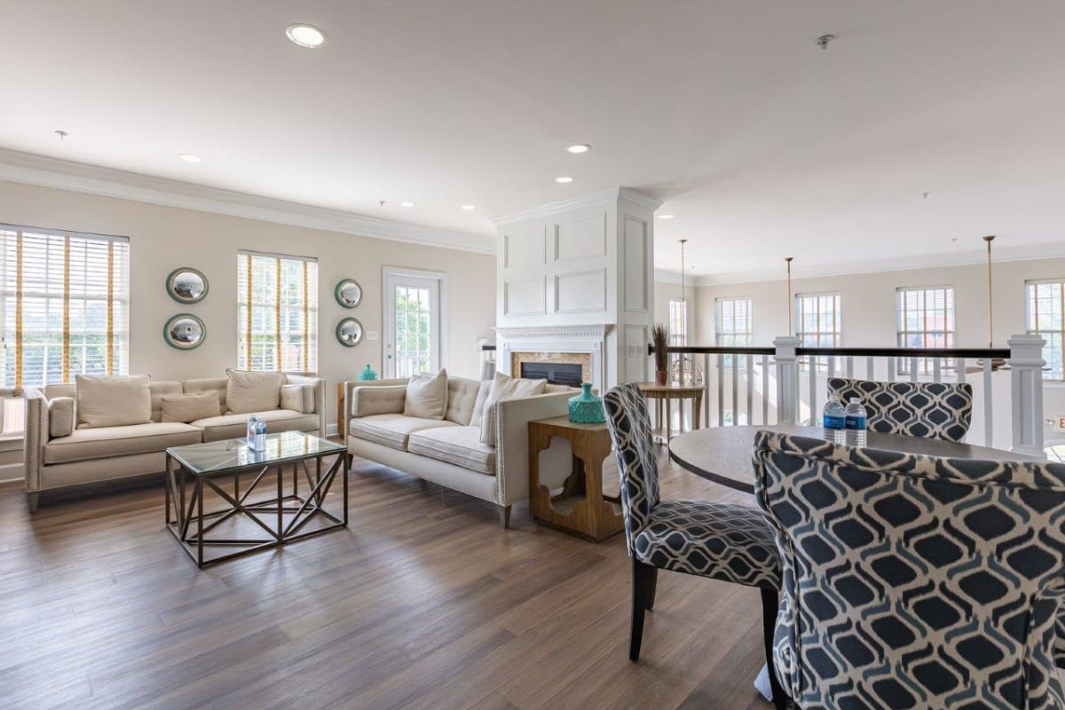 Comfortable clubhouse with couches at Atkins Circle Apartments and Townhomes