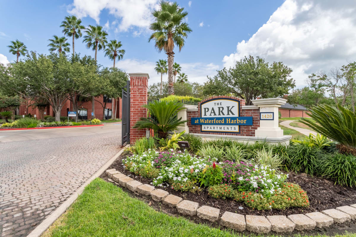 Community sign and landscaped entryway to The Park at Waterford Harbor in Kemah, Texas