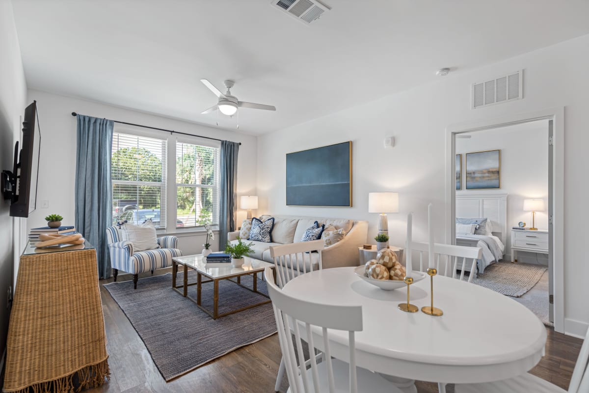 Dining table and living room in an apartment at The Griffon Vero Beach in Vero Beach, Florida