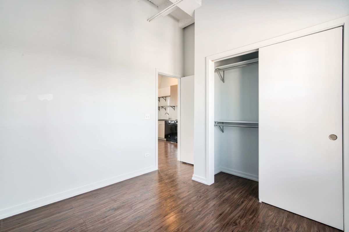 Resident living space with large closets at The Maynard at 5718 N Winthrop in Chicago, Illinois