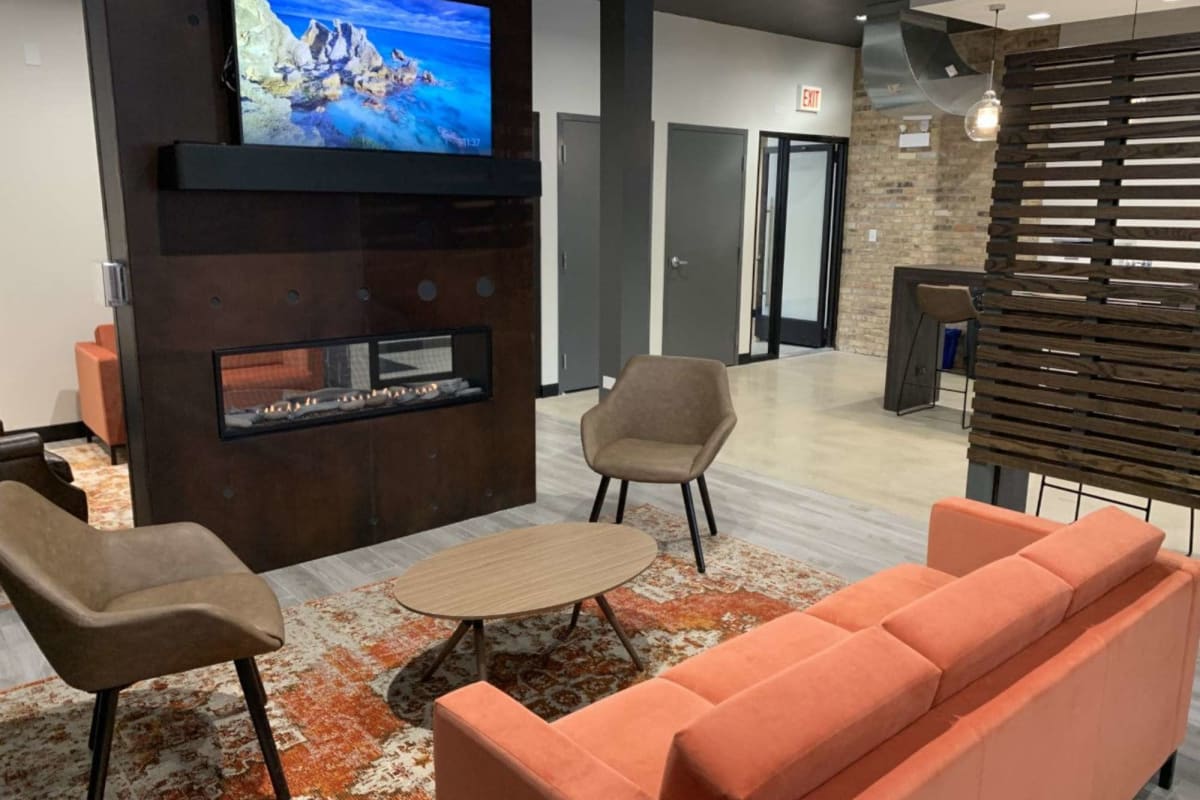 Community gathering spaces with a TV at The Maynard at 5115 N Sheridan in Chicago, Illinois