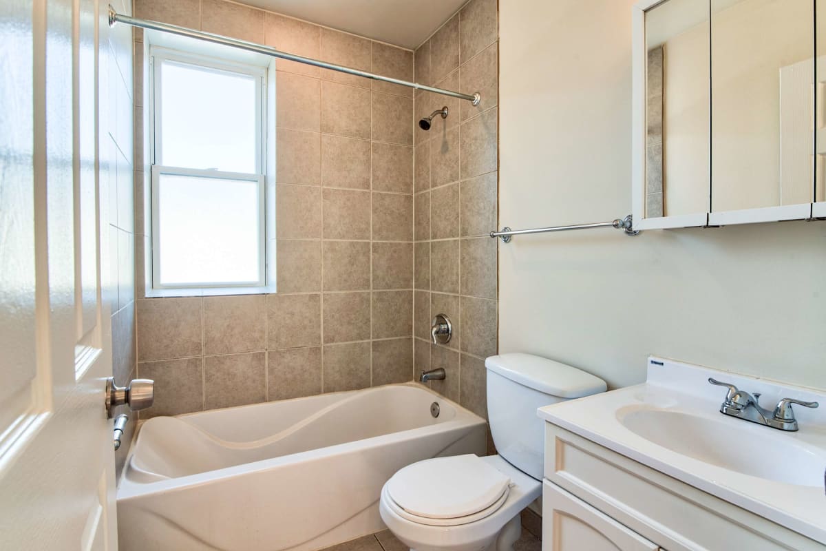 Resident bathroom with ample natural light at The Maynard at 3348 W Wilson in Chicago, Illinois