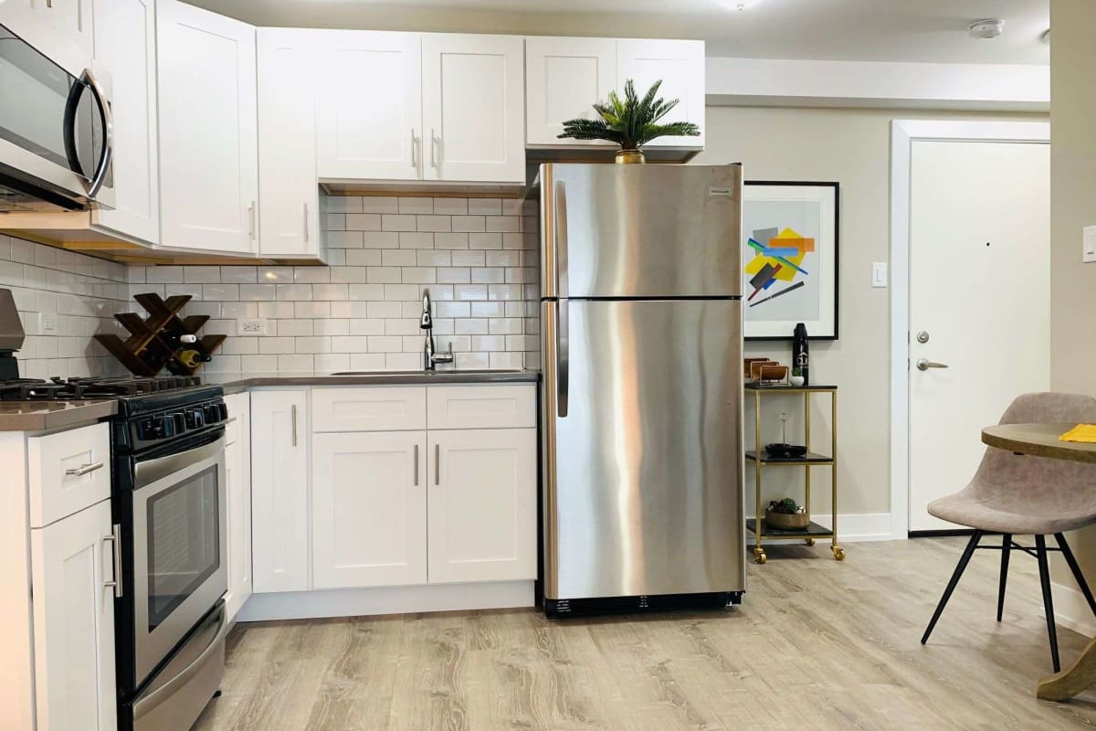 Modern kitchen with stainless-steel appliances at The Maynard at 2545 W Fitch in Chicago, Illinois