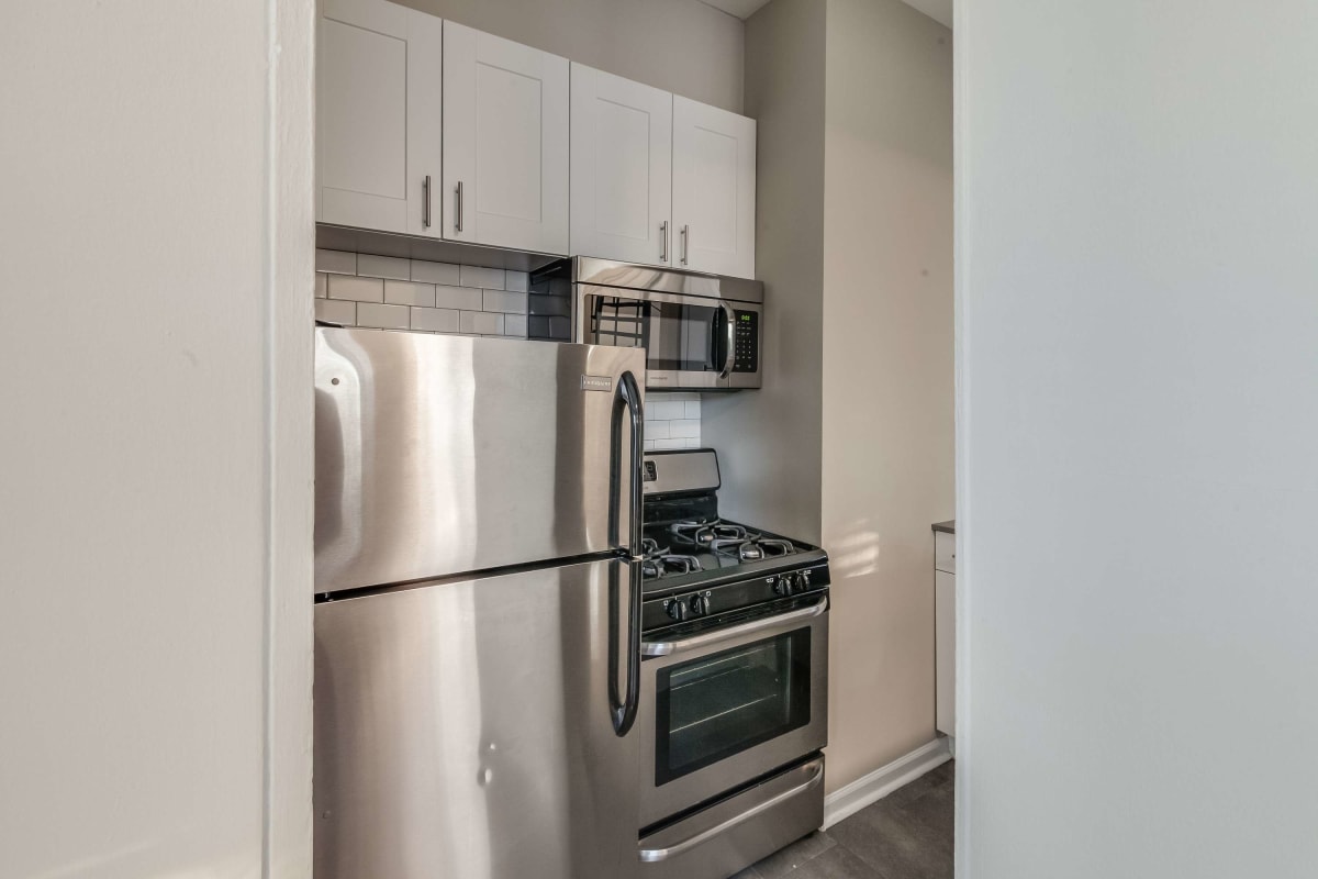 Modern kitchen with stainless-steel appliances at The Maynard at Elaine Place in Chicago, Illinois