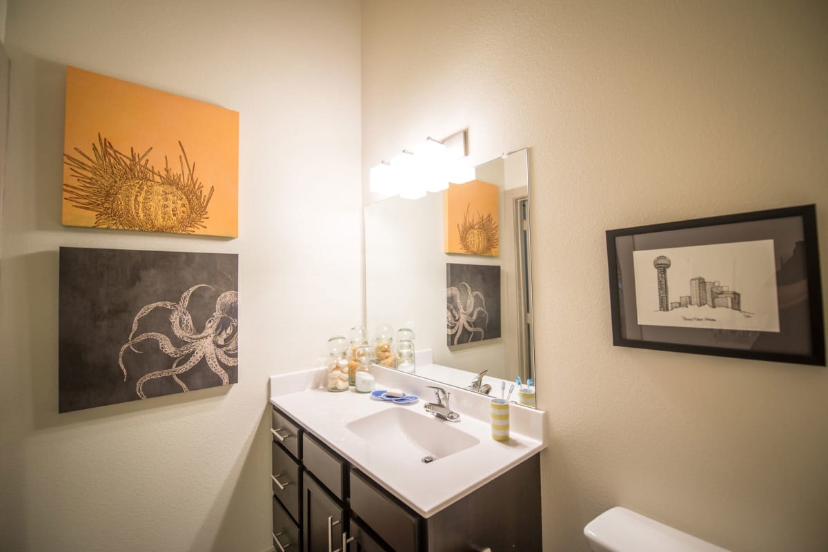 Vanity mirror in a model student apartment's bathroom at 33 North in Denton, Texas