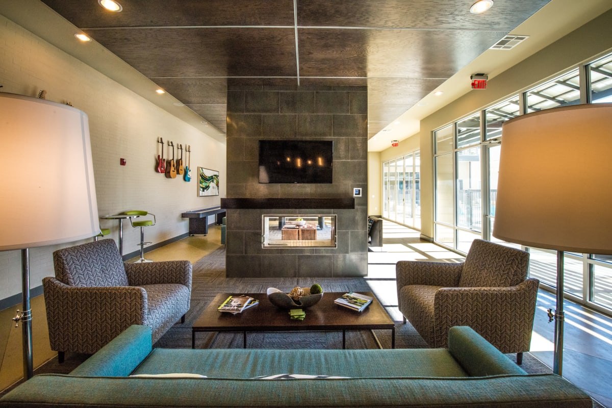 Clubhouse lounge with fireplace at 33 North in Denton, Texas