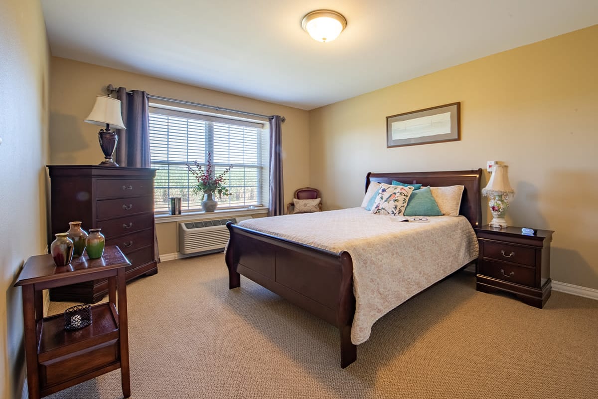 furnised bedroom of a model unit at Trustwell Living at Bailey Place in Bunkie, Louisiana