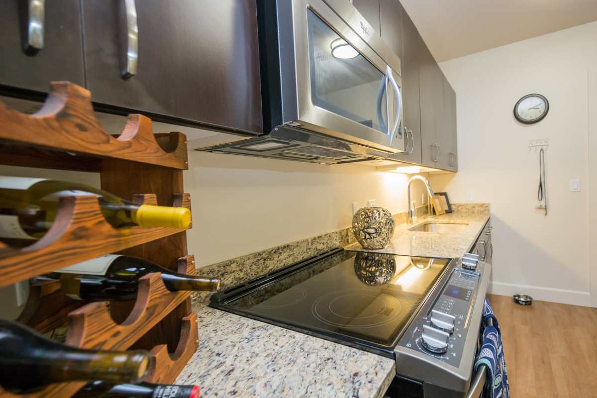 Kitchen with granite countertop at The Cameron in Portland, Oregon