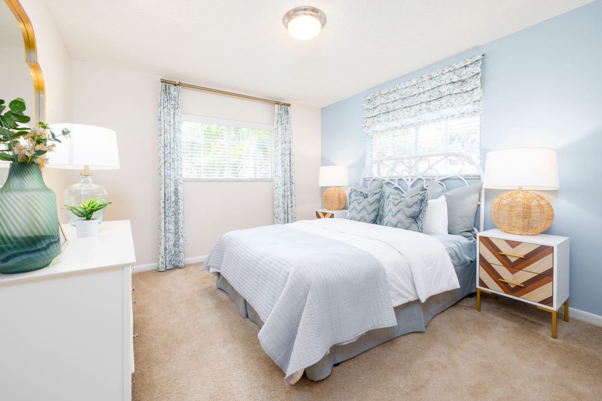 Plush carpeting in a furnished apartment bedroom at Azalea Village in West Palm Beach, Florida
