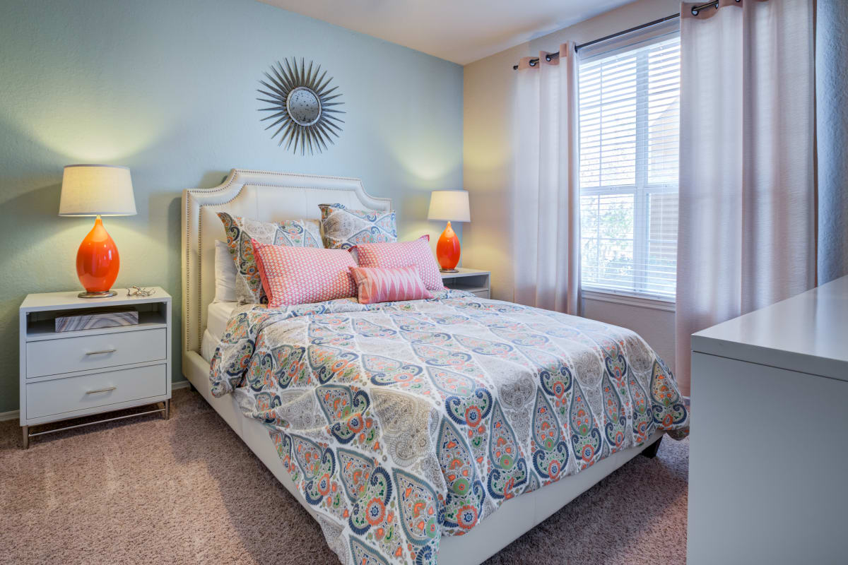Master bedroom with a ceiling fan at Vista Lake Ned in Winter Haven, Florida