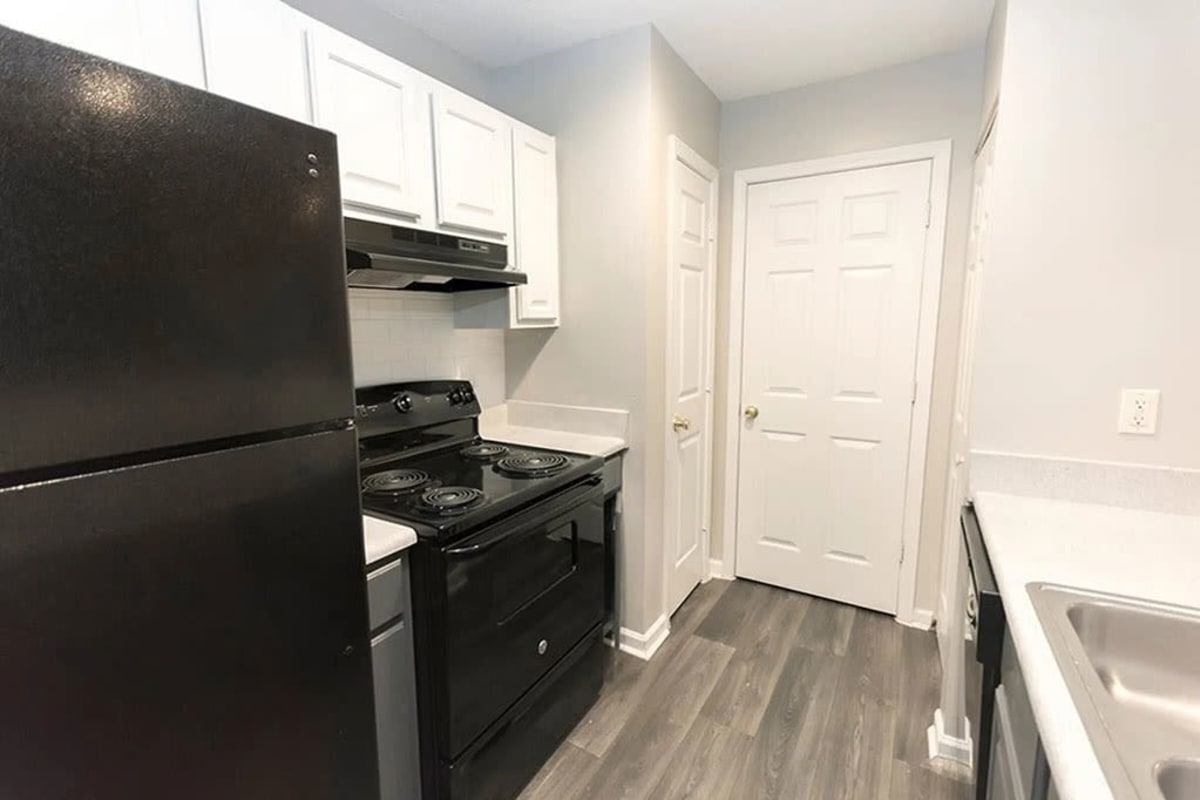 Wood-style flooring in an apartment kitchen at The Avalon in Charlotte, North Carolina