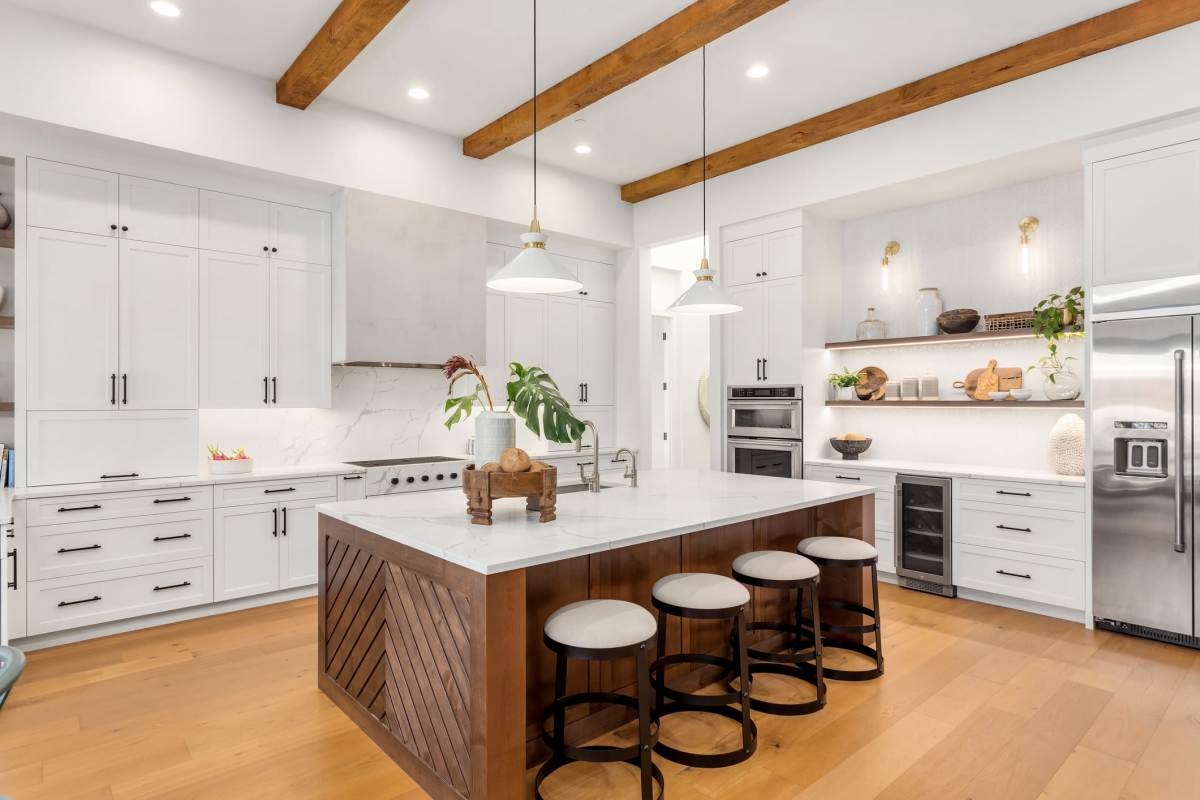 Sleek, modern kitchen with island seating at Walnut Woods in Turlock, California
