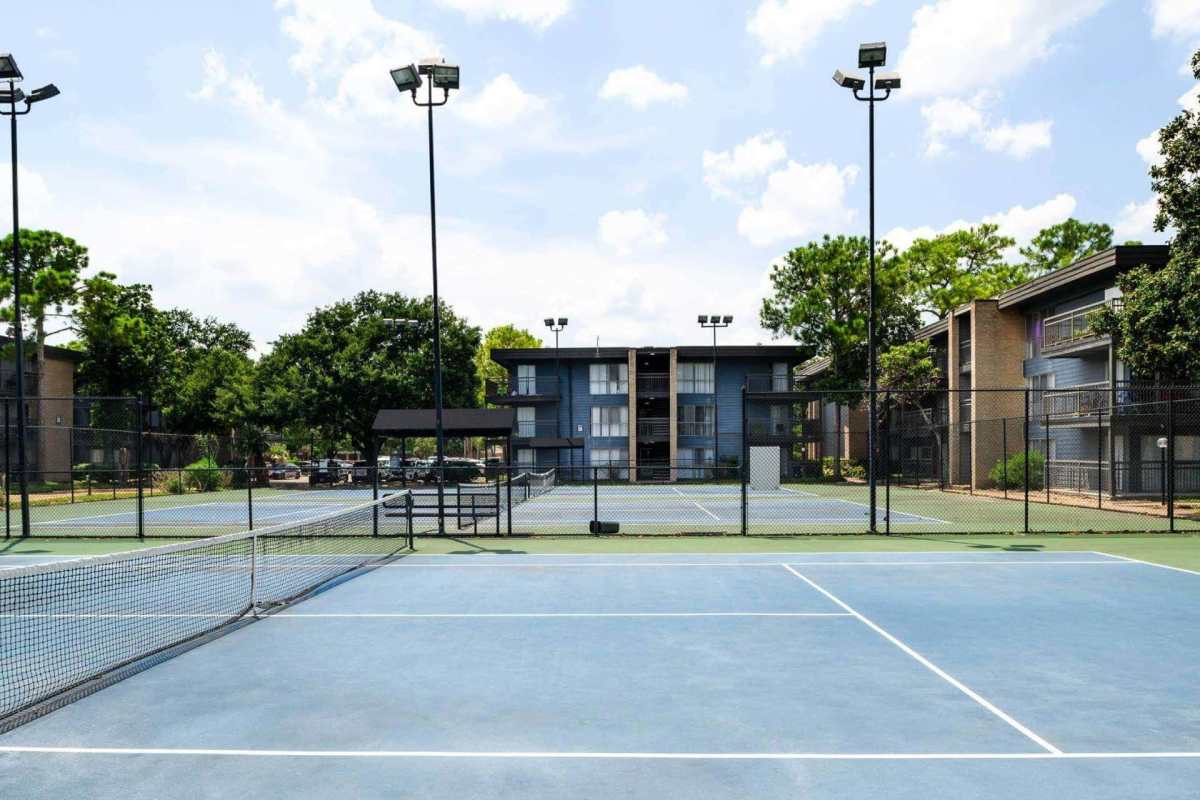 Woman in the pool at Star Voss Apartments in Houston, Texas