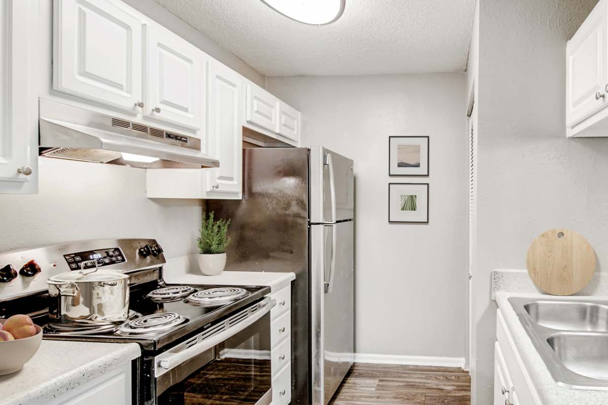 Kitchen with stainless-steel appliances at Brook Valley Apartment Homes, Douglasville, Georgia